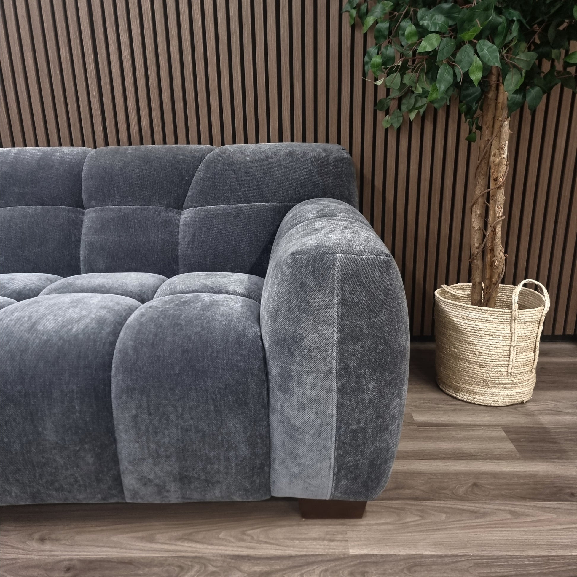 The corner view of the Aluxo Harlem Grey Steel Velvet 3 seater Sofa in bubble sofa style.
